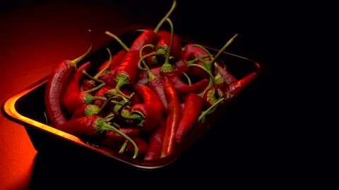 Red hot pepper in a dark studio Stock Footage 283721772
