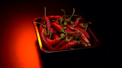 Red hot pepper in a dark studio Stock Footage 283721925