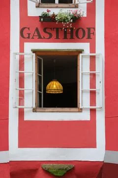 Red House with open window Stock Photos