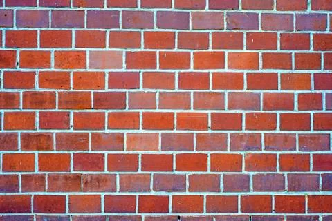 Red house wall of small bricks Stock Photos