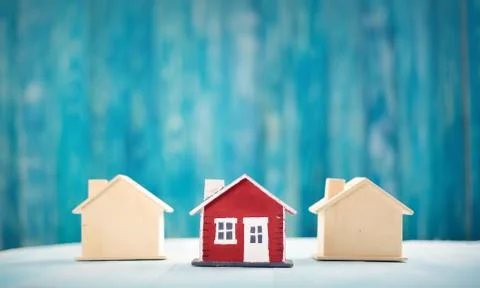 Red house on wooden background Stock Photos