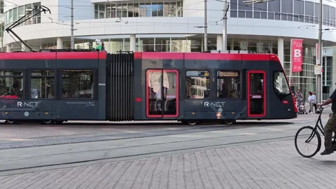 Red HTM City Tram Driving Down Downtown Street Stock Footage 342334685