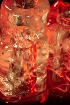 Red-Hued Ice Cubes in Dramatic Lighting Stock Photos