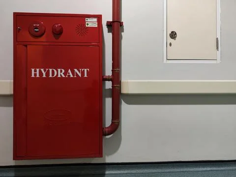 Red hydrant box and fire extinguisher Stock Photos