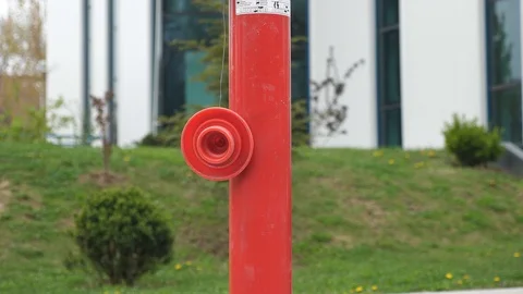 Red hydrant in front of the office building Stock Footage 106028268