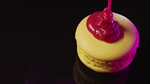 Red icing poured on a yellow cookie. Stock Footage 149126894