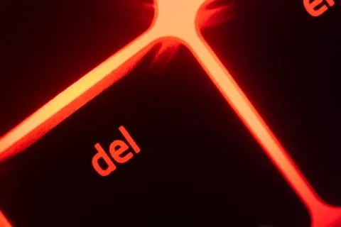 Red illuminated keyboard delete key closeup 스톡 사진