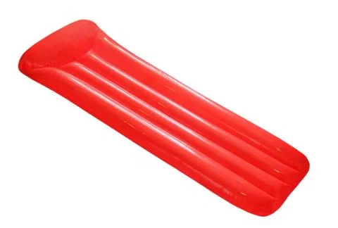 Red inflatable floating pool raft mattress isolated on white. Stock Photos