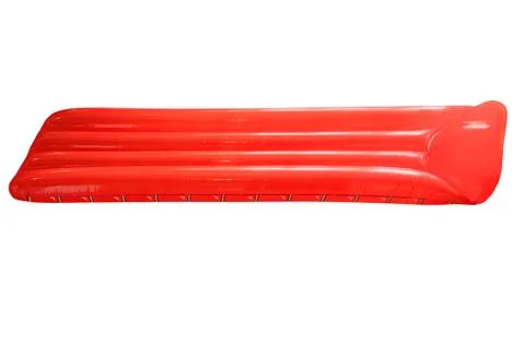 Red inflatable floating pool raft mattress isolated on white. Stock Photos