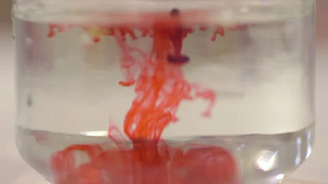 Red Ink Diffusing in Clear Water Close Up Stock Footage 339018201