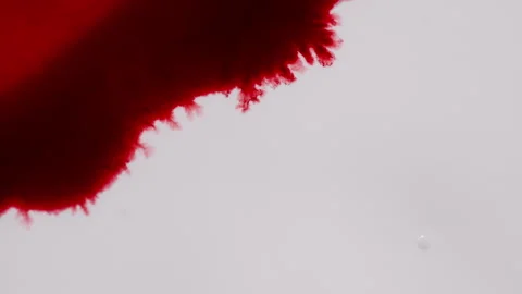 Red Ink Diffusing In Water Creating Abstract Background Video stock 316594428