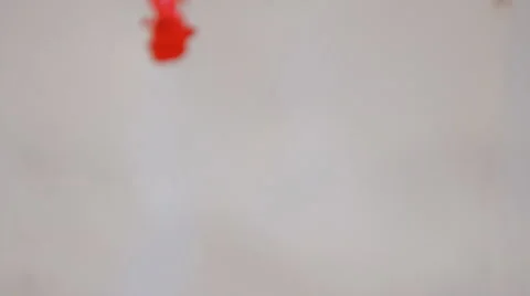 Red ink dissolve slowly Stock Footage 49545629