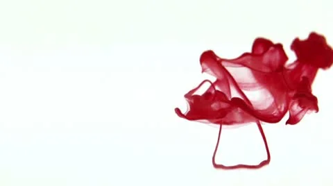 Red ink dissolves in water Stock Footage 8849443