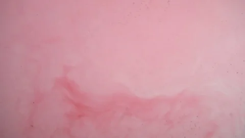 Red ink dissolving in clear water Stock Footage 71615783