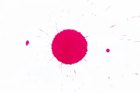 Red ink dot splashed on white paper background 스톡 사진