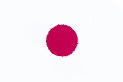 Red ink dot splashed on white paper background 写真素材