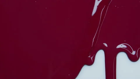 Red ink flowing over pink background. Stock Footage 238854157