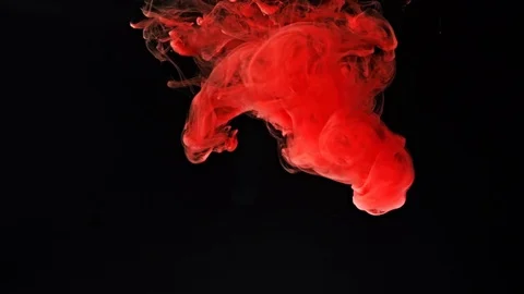 Red ink splash on black background Stock Footage 82189206