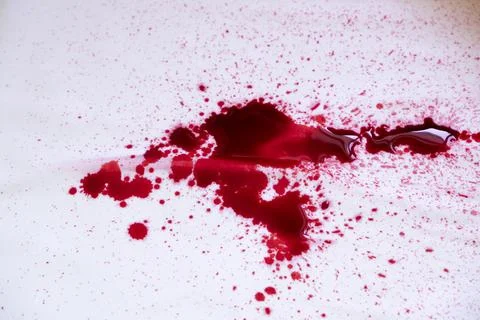 Red ink splatter on white background Stock Photos