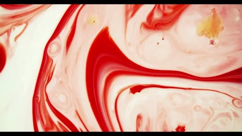 Red ink spreading through white liquid forming organic shapes Stock Footage 329816406