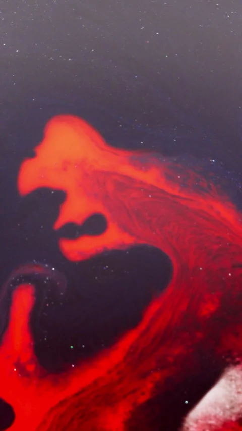 Red Ink Swirling in Dark Liquid Creating Abstract Galaxy-Like Patterns Stock Footage 340883218