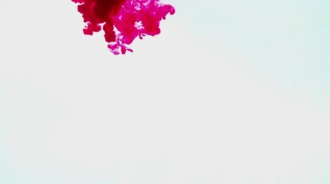 Red ink on a white background Stock Footage