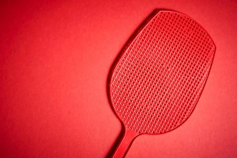 Red isolated plastic fly trap on intense colored background Stock Photos