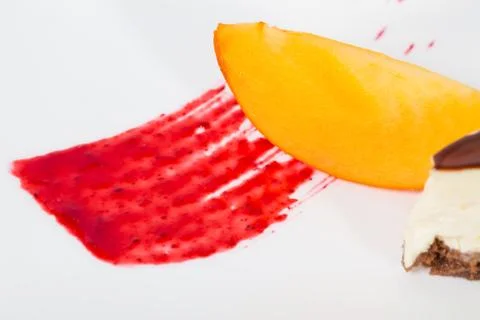 Red jam and mango closeup. Stock Photos