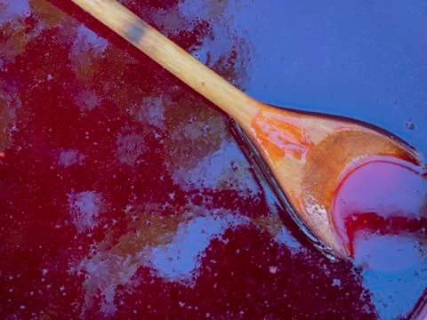 Red jam and spoon Stock Photos