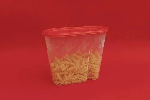 Red jar with macaroni on red background, monochrome Stock Photos