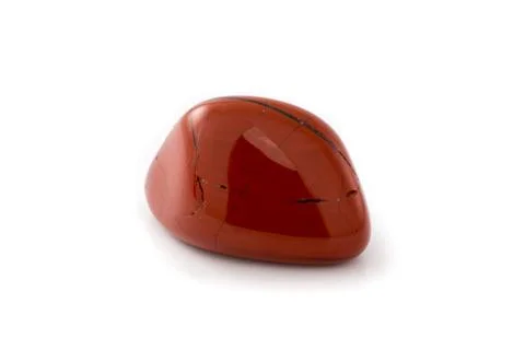 Red jasper gem on a white background. Stock Photos