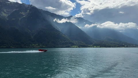 Red Jet Boat Speeding on Lake Brienz Turquoise Water, Interlaken Swiss Stock Footage 338429112