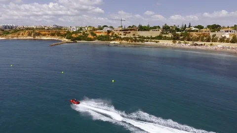 Red Jet ski Cabo Roig beach Orihuela Costa aerial view Stock Footage 129511209