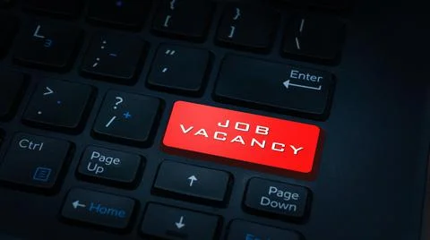 A red JOB VACANCY button on dark keyboard  background - application job caree Stock Photos