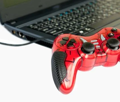 Red joystick game controller on laptop . 写真素材