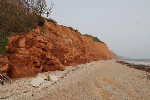 The red Jurassic cliffs at the eastern end of Sidmouth Esplanade. Due to eros Stock Photos