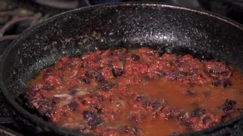 Red kidney beans frying in red sauce in a pan, close-up Stock Footage 73623033