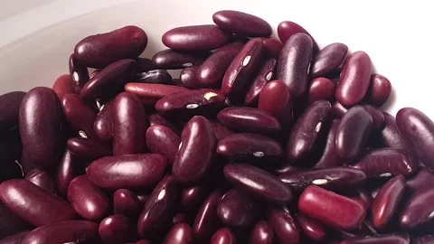Red Kidney Beans turning inside white ceramic bowl. Stock Footage 161910503