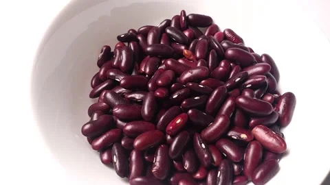 Red Kidney Beans turning inside white ceramic bowl. Stock Footage 161910540