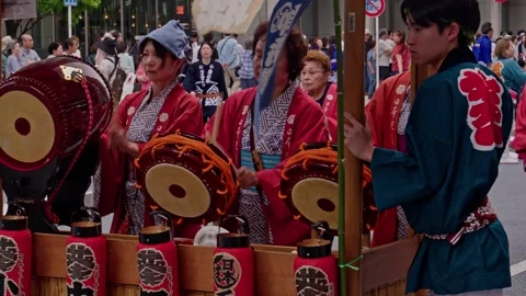 Red-Kimono Drummers Strike Taiko Drums on Festival Float Stock Footage 341570094