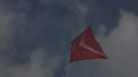 Red kite flying into the sky with clouds - Close Up | LOG Stock Footage 124794210
