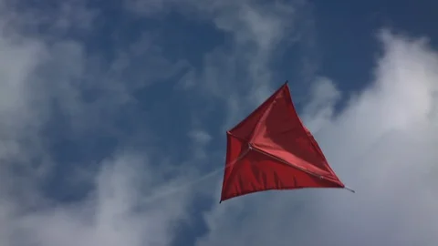 Red kite flying into the sky with clouds - Close Up | Color Corrected Stock Footage 124794767