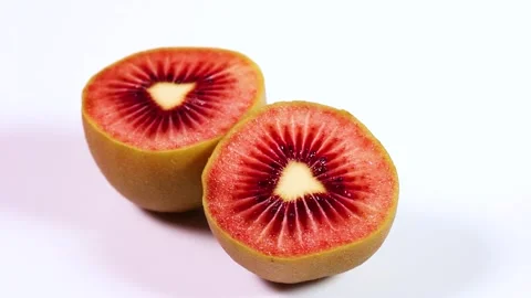 Red kiwi fruit on white background, rotating Stock Footage 309429591