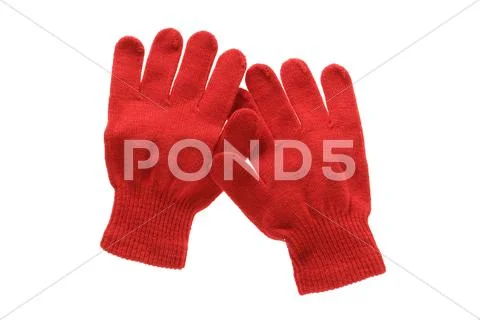 Red knitted cloth kid gloves with pattern isolated on white background. Stock Photos
