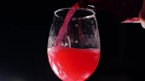 Red Kombucha Pours Into Clear Glass Creating Bubbles In Captivating Slow Motion Stock Footage 346273953