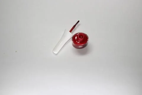 Red lacquer on the isolated white background Foto stock