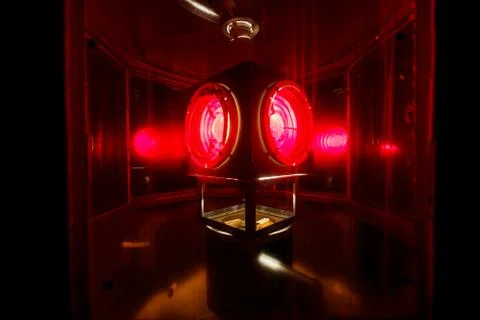 Red lamp inside the lighthouse tower Stock Photos