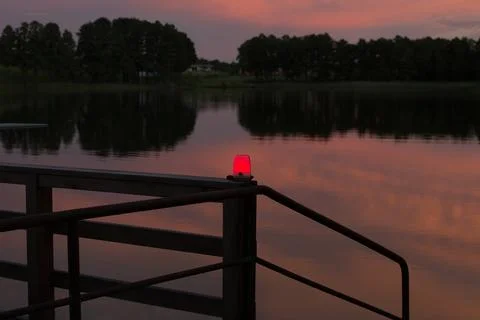 Red lamp on the pier Stock Photos