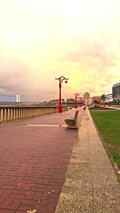 Red Lamps Lining a Promenade on a Cloudy Day Stock Footage 276331827