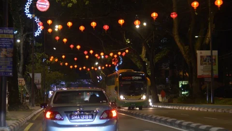 The red lantern lights driving pov through downtown Stock Footage 102452324
